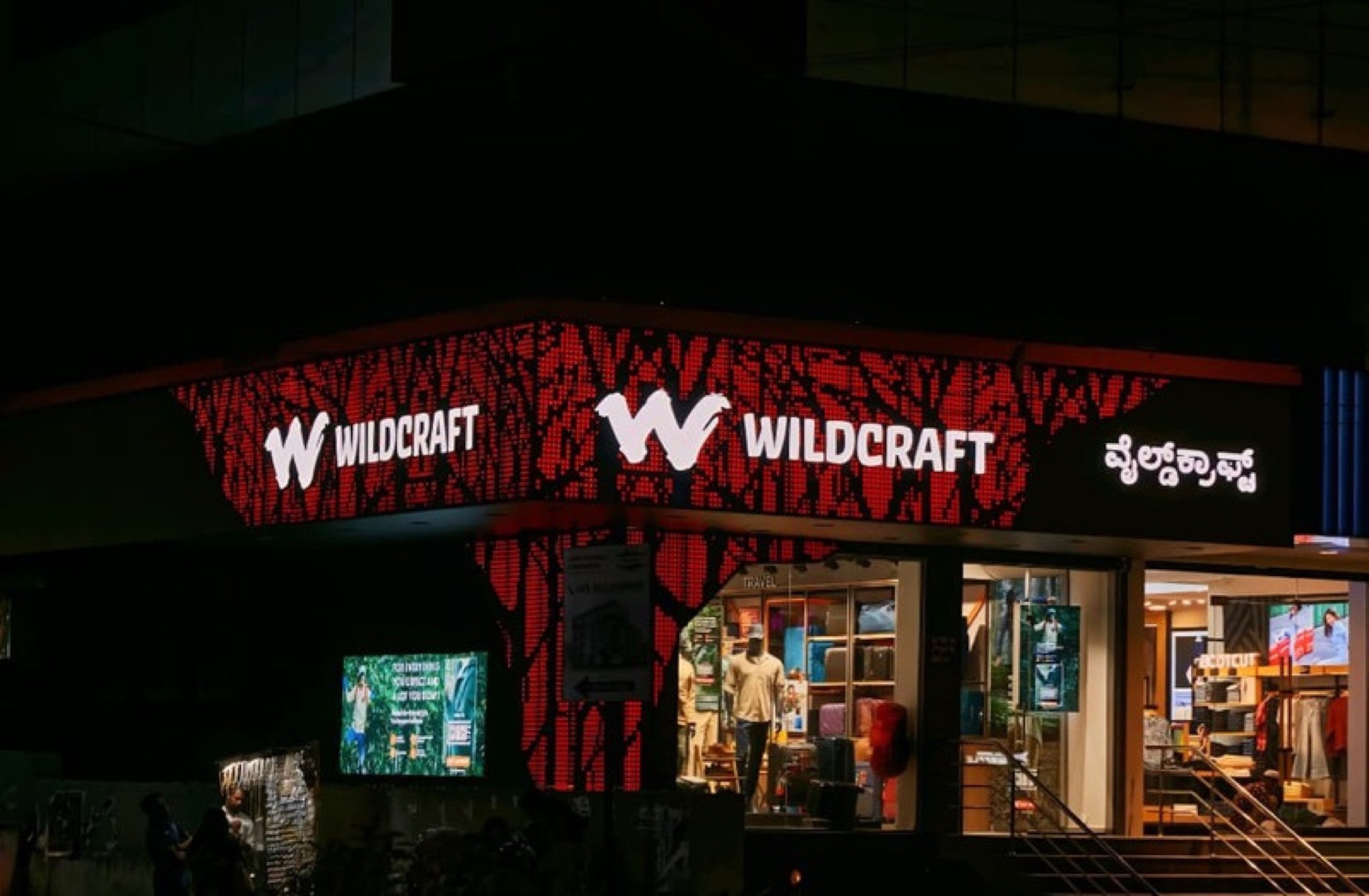 Wildcraft façade signage at night